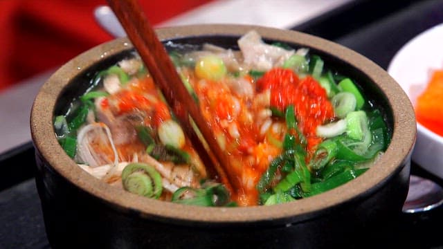 Bowl of chicken soup with red marinade