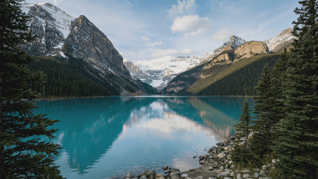 Tranquil lake surrounded by mountains.