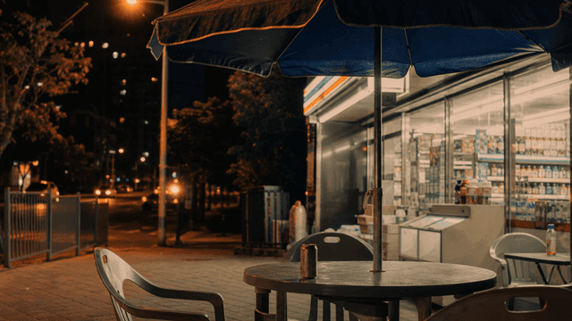 Night convenience store outdoor table with canned beer
