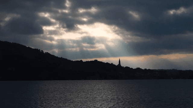 River with sunlight shining through clouds