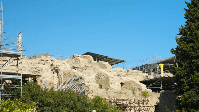 Ancient ruins under restoration on a sunny day