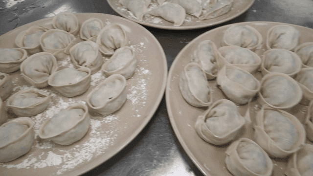 Plates of freshly made dumplings