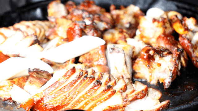 Pig's trotters sizzling in pan