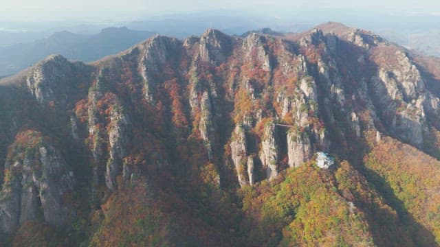 Majestic mountain range with autumn foliage