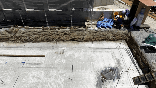 Construction site with workers and materials