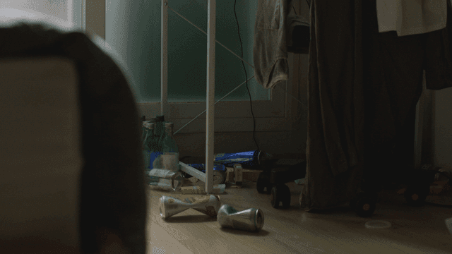 Messy room with scattered bottles and clothes