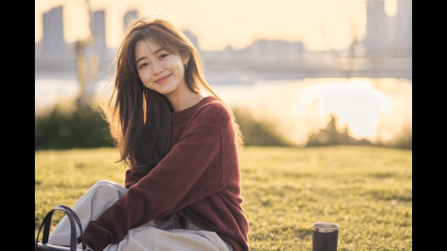 A woman enjoying a sunny day in the park
