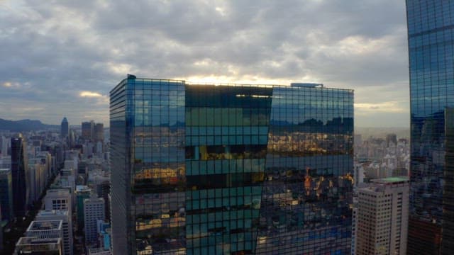 Sunrise over a city skyline with skyscrapers