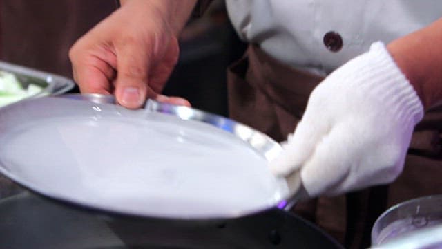 Tray with starch batter placed on top of hot water