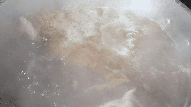 Pot of broth boiling fiercely