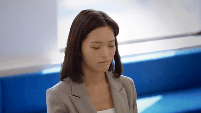 Nervous woman in suit at interview