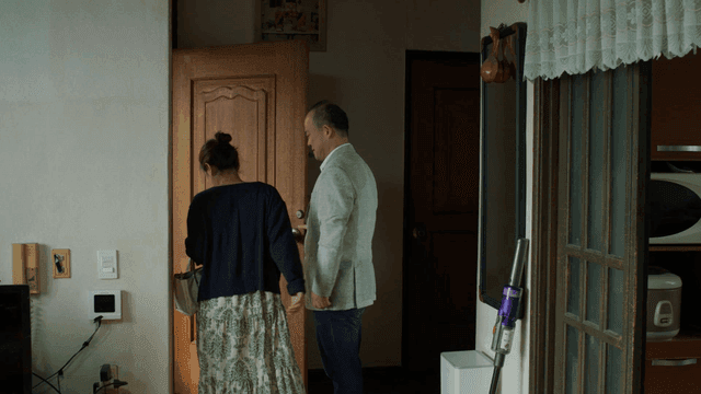 Loving couple leaving house