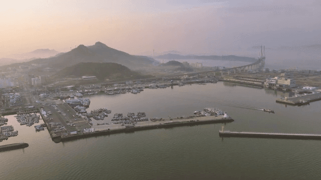 Coastal village with a bridge at dawn
