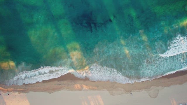 Waves crashing on a sandy beach