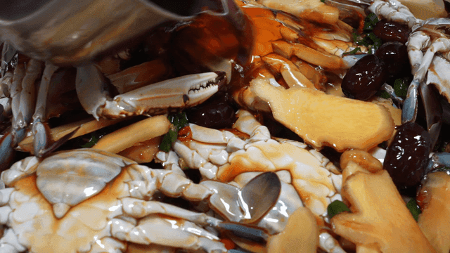 Soy sauce poured over seasoned crab