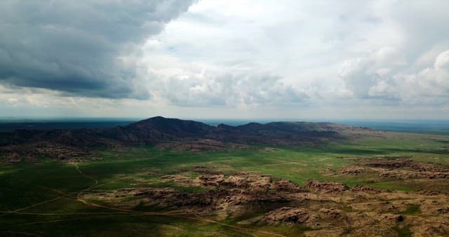 Vast landscape with mountains and clouds