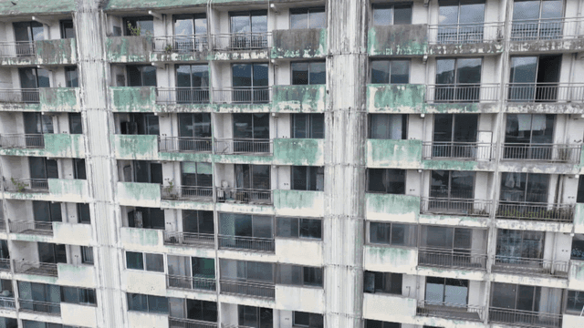 Old apartment building with peeling paint