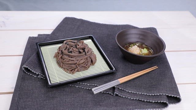 Cold soba served with buckwheat noodles and broth