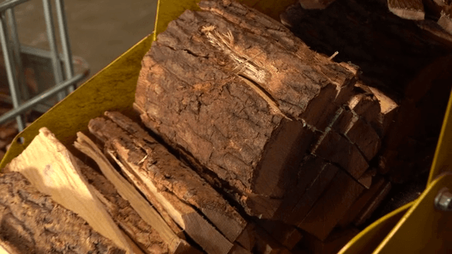 Stack of cut wood pieces on a conveyor