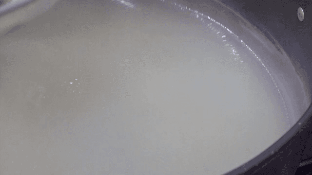 Soup boiling in a pot with ingredients