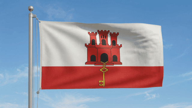 Gibraltar flag fluttering under clear sky