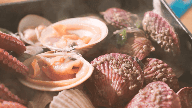 Steaming seafood in a pot with clams