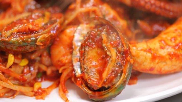 Spicy braised spicy seafood dish with octopus and abalone