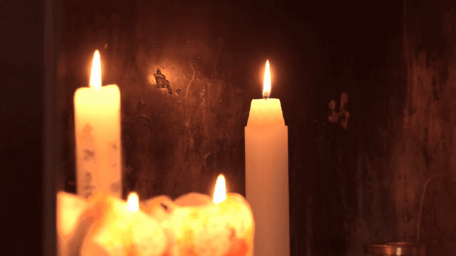 Candle burning softly indoors
