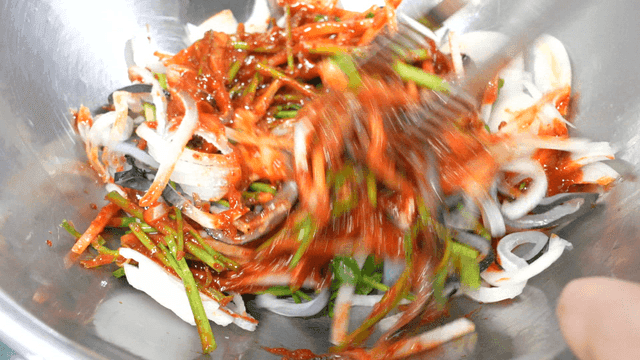 Seasoned pufferfish skin mixed with spicy sauce and vegetables