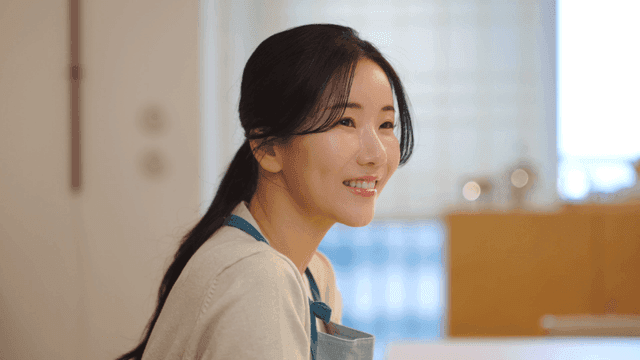 Smiling woman in cozy home