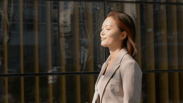 Working woman enjoying sunshine