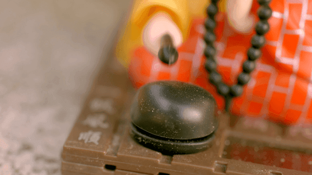 Souvenir of small monk striking moktak