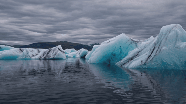 Floating icebergs in a calm sea