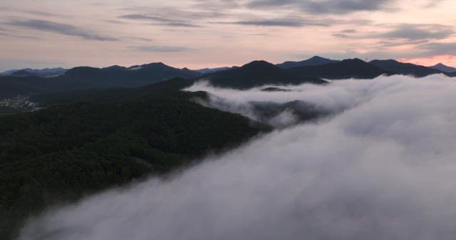 Mountains with clouds at sunrise