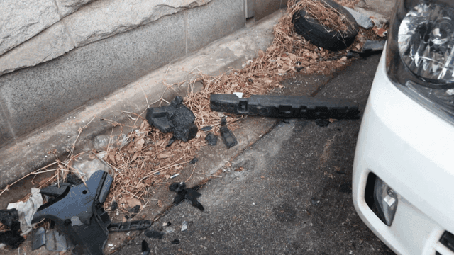 Vehicle debris and trash on street