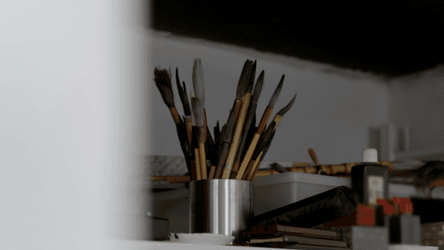 Collection of brushes in container