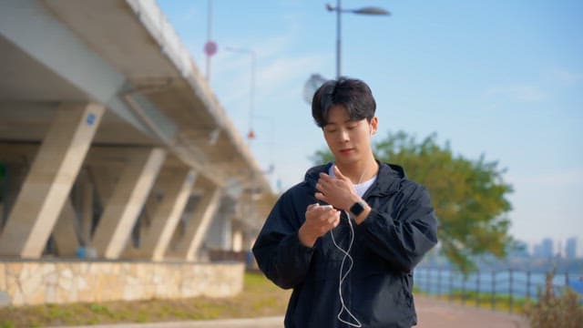 Man checking smartphone outdoors