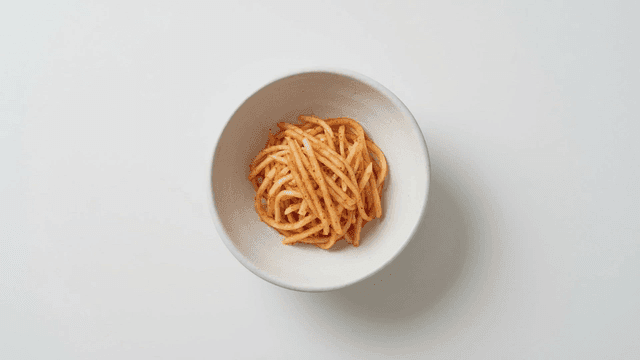 Bowl containing seasoned radish salad