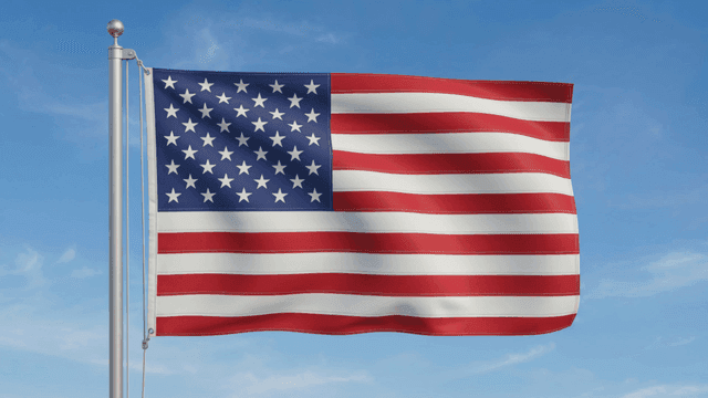 American flag waving against a blue sky