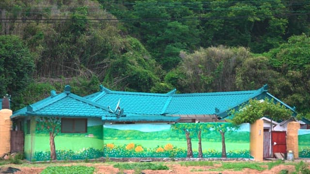 Rural House with a Mountain Behind and Beautiful Murals