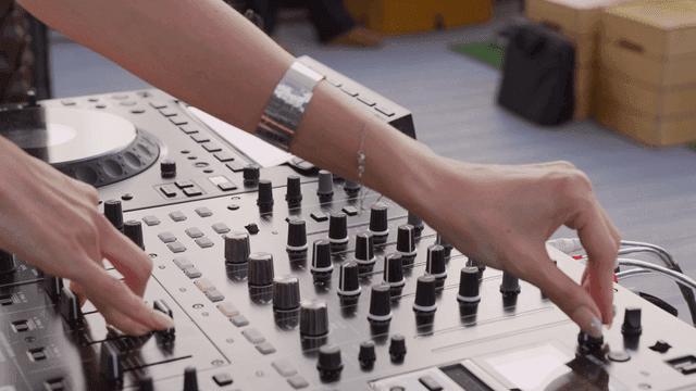 DJ operating DJ equipment