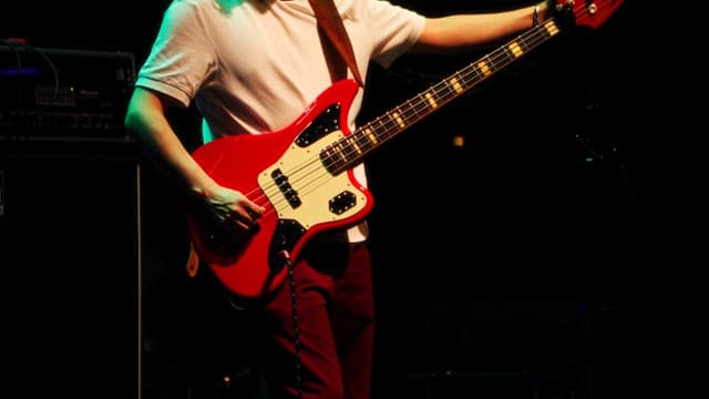 Musician Playing Bass Guitar on Stage