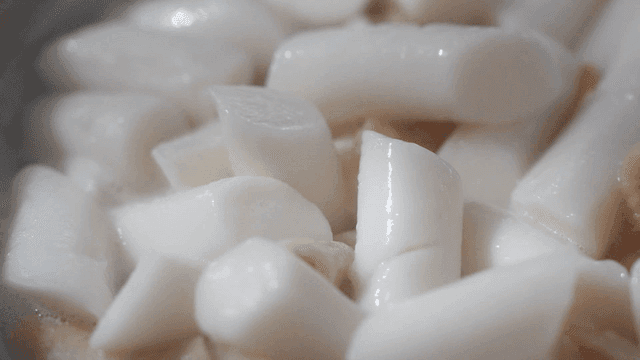 Korean rice cakes boiling in a pot