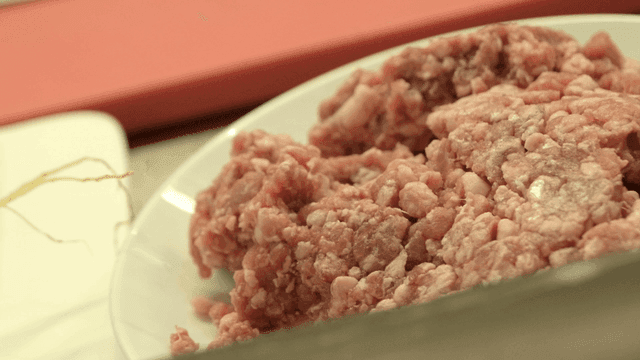 Raw minced meat on a white plate