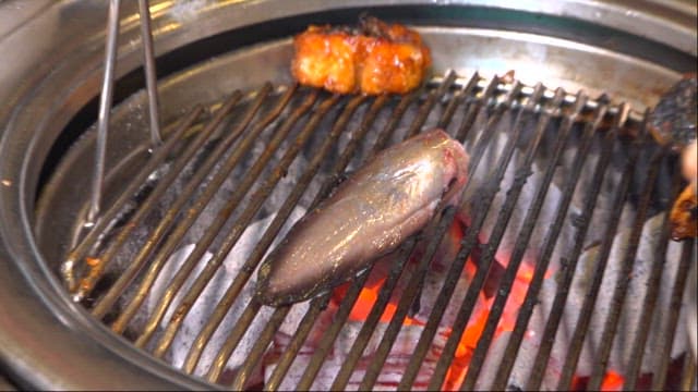 Eel tail grilled over charcoal