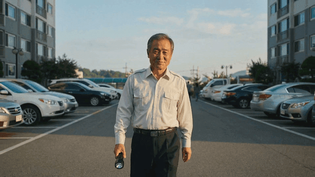 Elderly security guard patrolling apartment parking lot