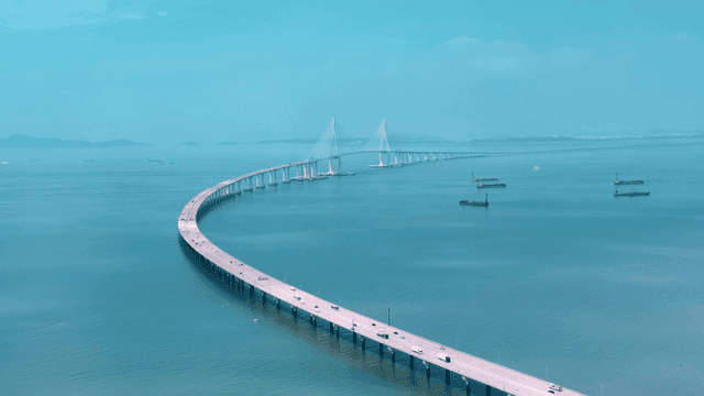 Long bridge stretching over sea.