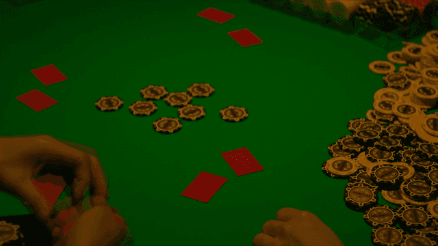 Person scattering Hwatu cards on table