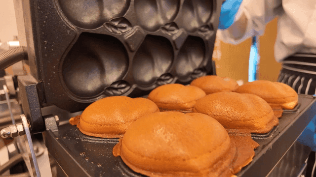 Well-baked peach bread coming out of mold