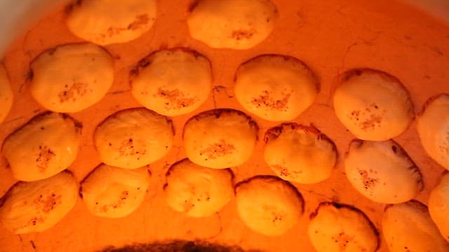 Bread baking in a traditional fire pot